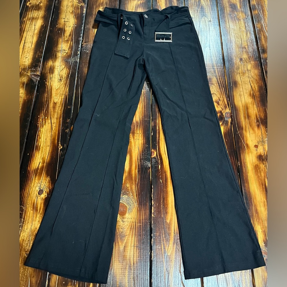 Low rise flare pants with built in black belt.